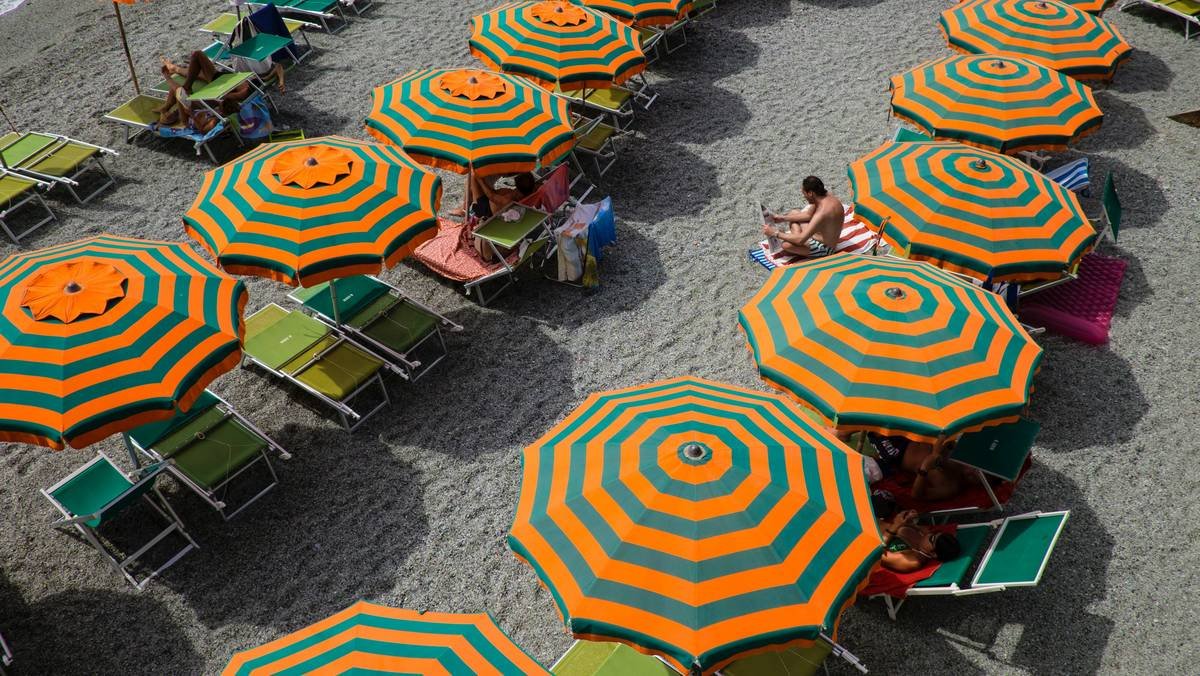 Infographic showing common beach umbrella accident scenarios and associated liability risks